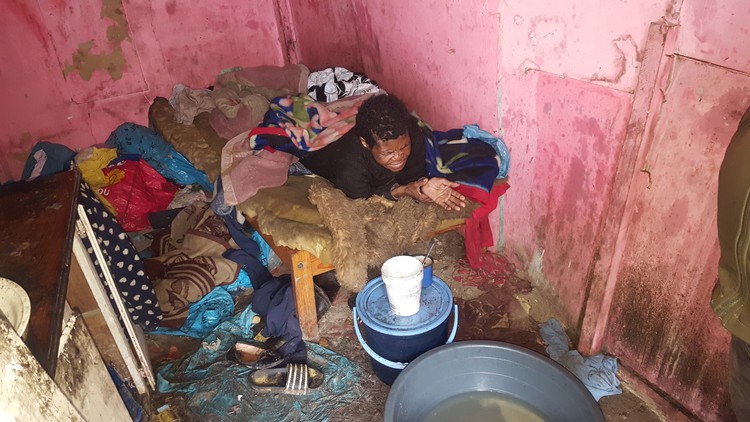 Photo of woman in shack