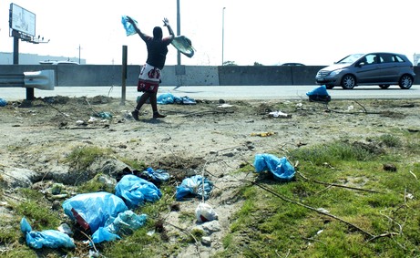 Photo of man throwing faeces.