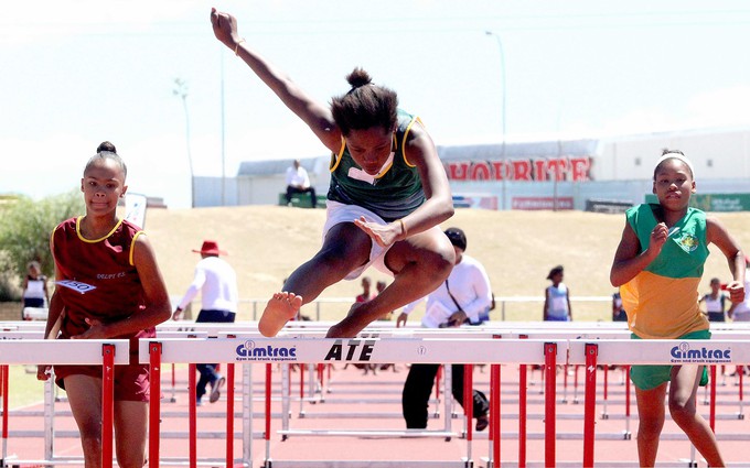 Photo of girl doing hurdles