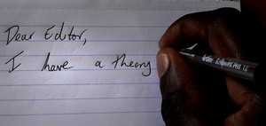 Photo of hand writing a letter