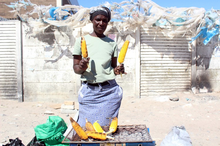 Shila Jubu sells corn that she says is imported from Zimbabwe.