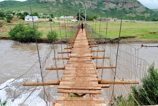 Photo of a rickety wooden hang bridge