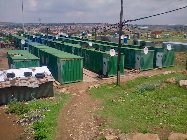 Photo of a row of shipping containers