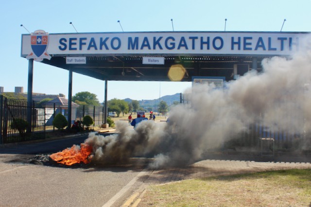 Photo of burning tyres at a hospital entrance
