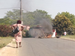 Photo of burning wood in road