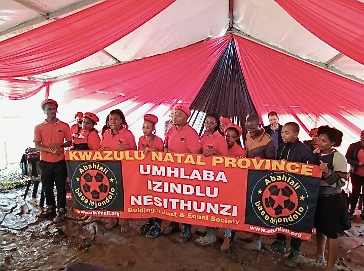 Photo of a group of people with a banner