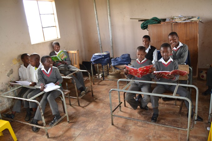 Photo of children in dilapidated classroom