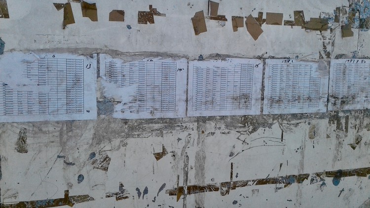 Photo of a list on a fibrecrete wall