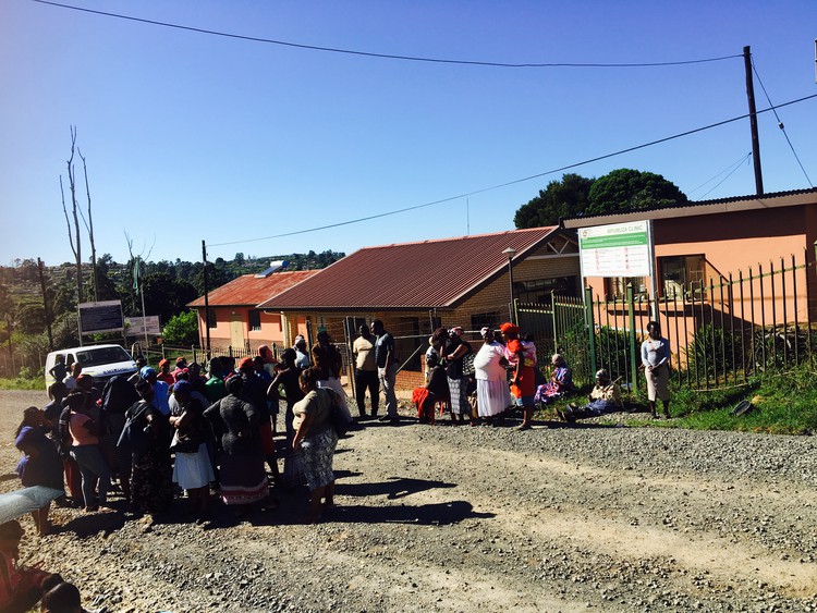 Photo of people outside clinic building