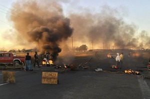 Photo of residents blocking roads with burning tyres