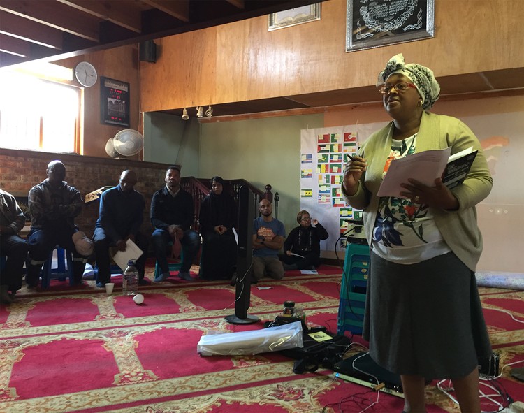 Photo of woman speaking in mosque