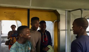 Photo of four youngsters in a train