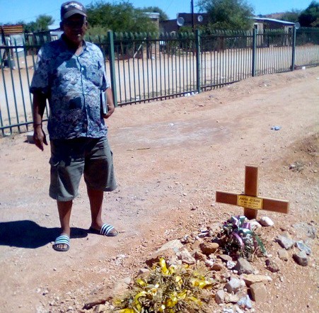 Photo of a man at a grave