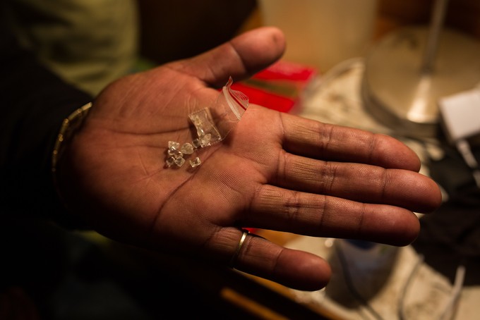 Photo of uncut diamonds in a hand
