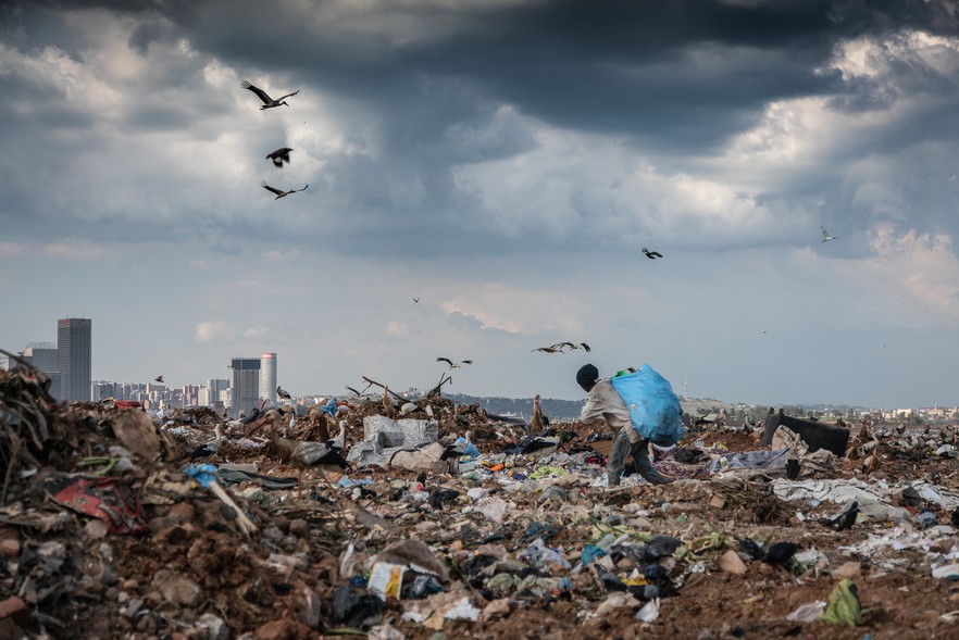 Photo of waste picker on rubbish dump