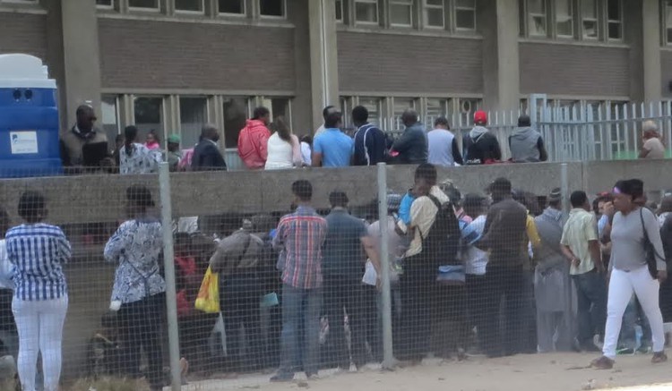 Photo of queue outside Home Affairs office