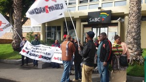 Photo of protesters picketing outside SABC offices