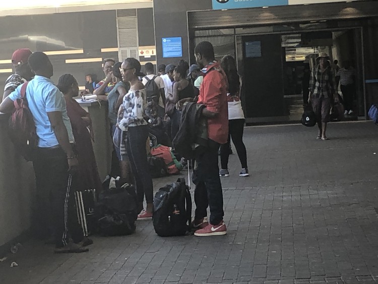 Photo of people waiting for bus