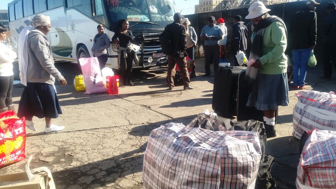 Photo of people and a bus