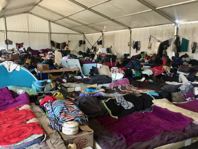 Photo of people in a large tent