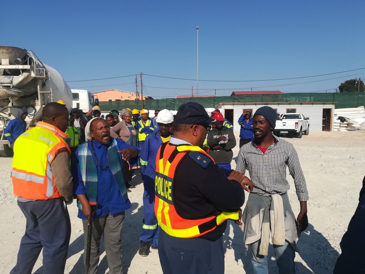 Photo of protesters speaking to police