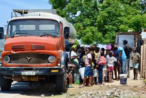 Photo of people at a water tanker