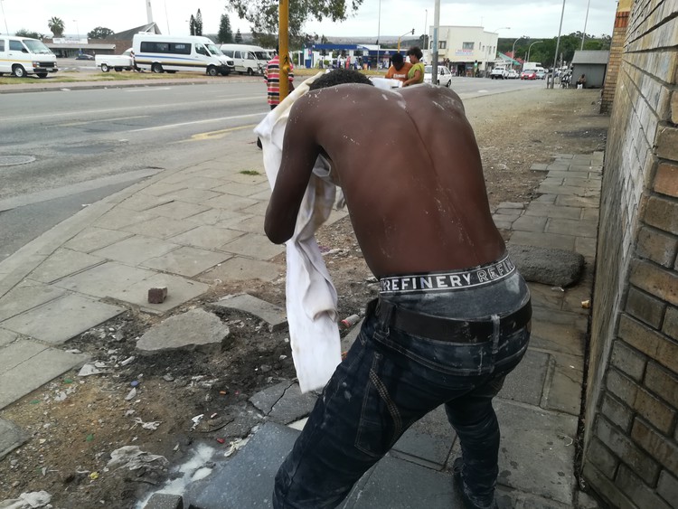 Photo of boy washing himself