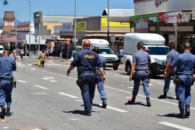 Photo of police walking down main street