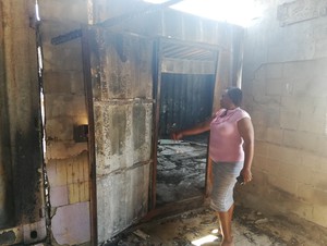 Photo of woman in burned house