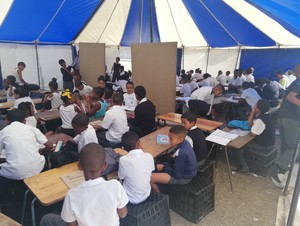 Photo of learners in the tent