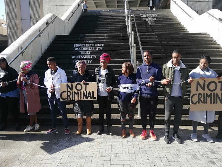 Photo of people chained to civic centre