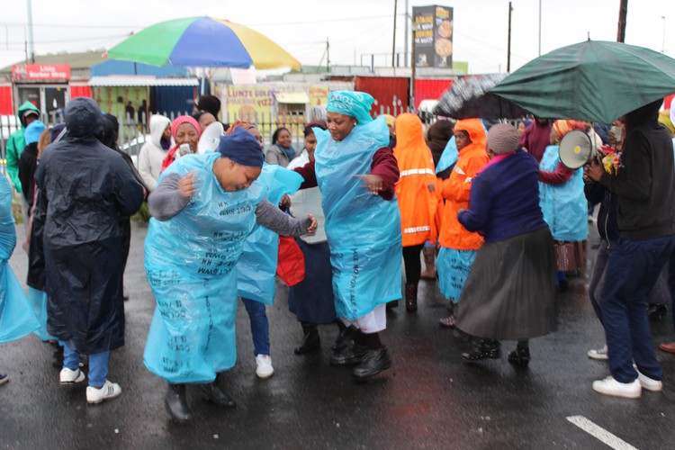 Photo of people wearing plastic bags