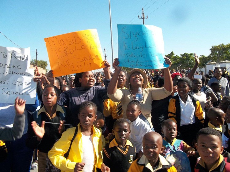 Photo of parents and learners marching