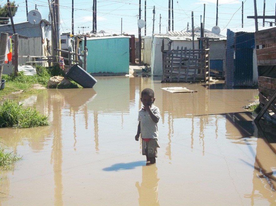 Photo of child in flooded area