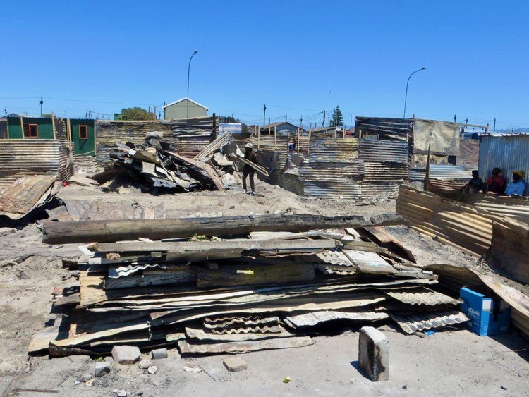 A pile of burnt poles and zinc sheets in Town Two. Photo: Vincent Lali