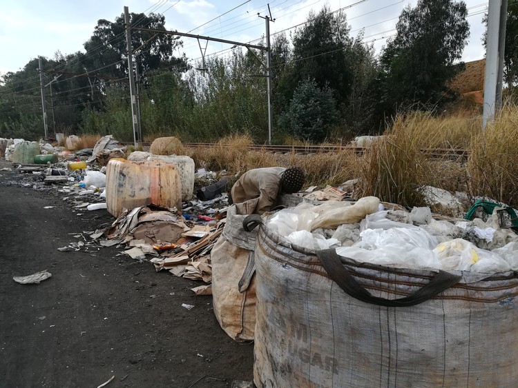 Photo of a man sorting rubbish