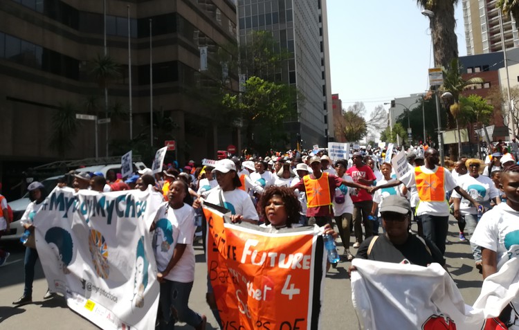 Photo of people marching through Johannesburg