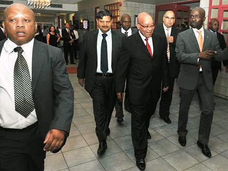 Photo of president Zuma walking with other men