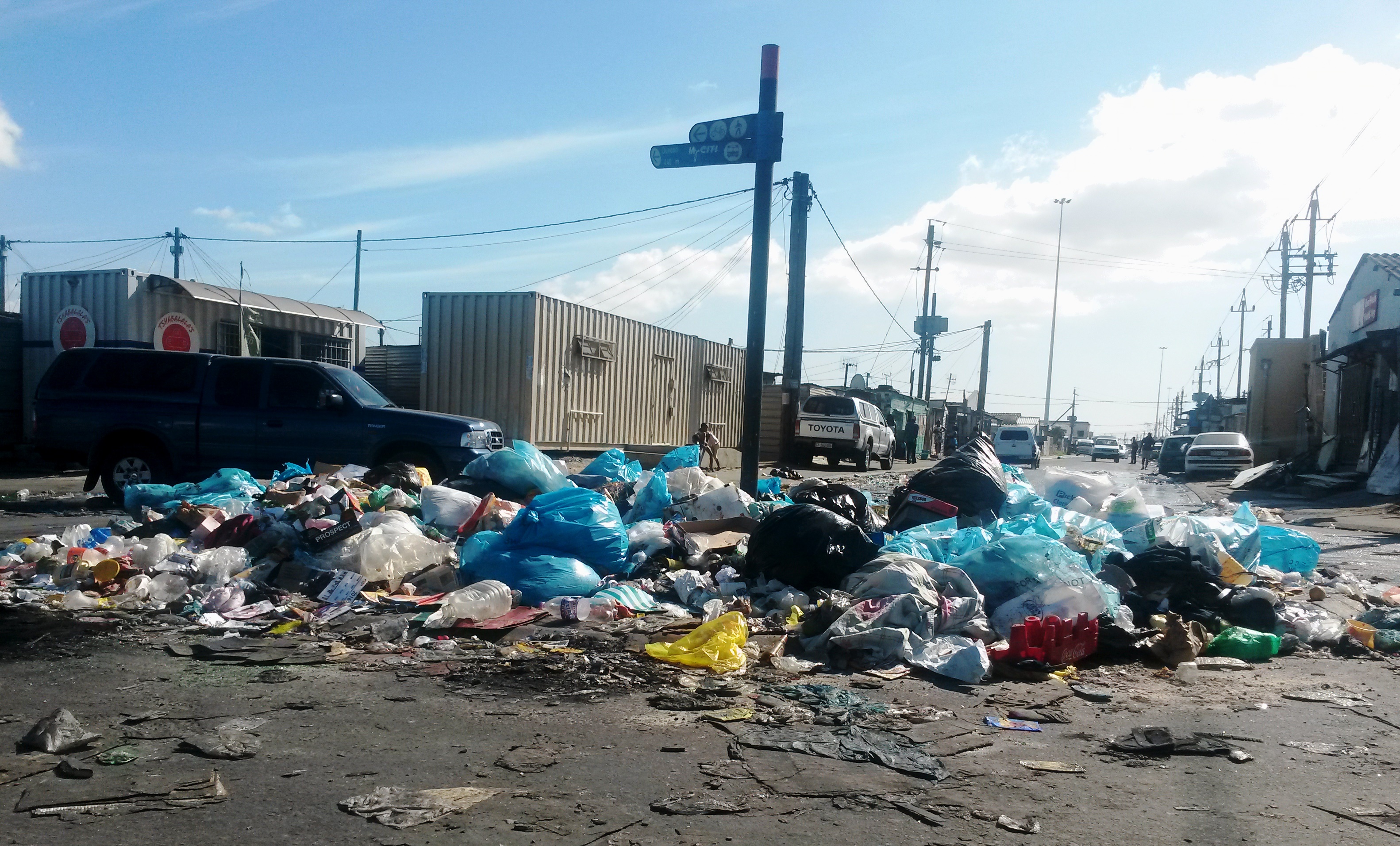 Photo of piles of rubbish in a road