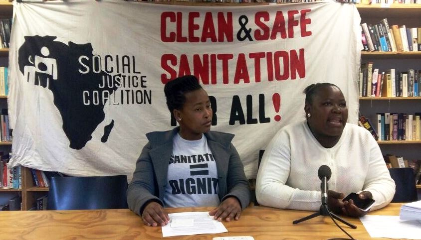 Photo of two women at a press conference