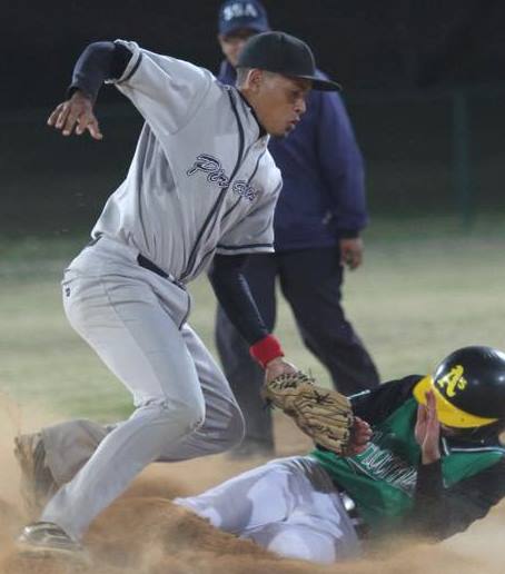 Photo of softball action.